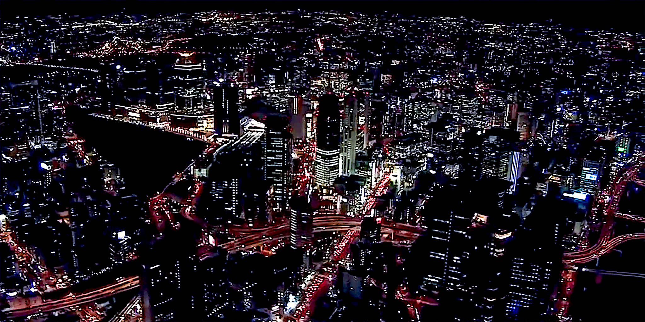 ヘリコプターで大阪上空から見る梅田駅周辺の夜景